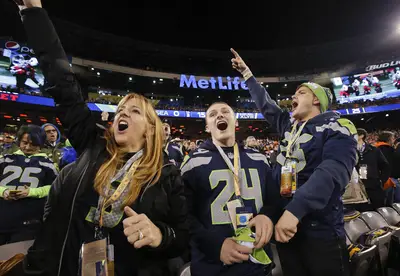 Dedicated Fans - Fans clearly heeded advice to leave plenty of time for their commute. Security was slow at train stations, but by 5:15 p.m., 80,000 folks had already made it in. NFL spokesman Brian McCarthy said it was the earliest arriving Super Bowl crowd in at least 30 years.(Photo: AP Photo/Kathy Willens)