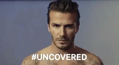 H&amp;M - H&amp;M shot two versions of a David Beckham commercial for the Super Bowl and the clothing brand gave fans the choice to vote on whether he’ll appear covered or uncovered. In the teaser, he flies off a billboard and finds his way to a photo shoot, where he poses nude or with his David Beckham body wear.&nbsp;(Photo: H&amp;M)