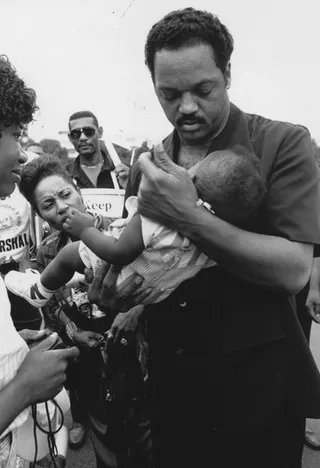 Jesse Jackson Holds Infant