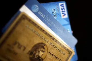 Pay Down Debt - Have you been paying the minimum on your credit card each month? You could save hundreds or even thousands of dollars in interest if you use some of your refund to make a significant dent in your debt.&nbsp; (Photo Illustration: Spencer Platt/Getty Images)