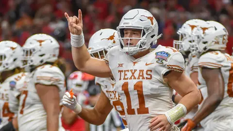 NEW ORLEANS, LA - JANUARY 01: Texas Longhorns quarterback Sam Ehlinger (11) gives the roaring Texas crowd a Hook 'em Horns sign after scoring a first half rushing touchdown during the Sugar Bowl football game between the Texas Longhorns and Georgia Bulldogs at Mercedes-Benz Superdome on January 1, 2019 in New Orleans, Louisiana. (Photo by Ken Murray/Icon Sportswire)