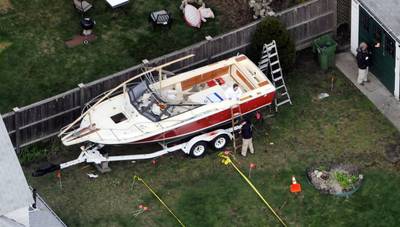 A Possible Motive - As he hid inside a boat in the Watertown neighborhood, Tsarnaev allegedly scrawled the words &quot;F*** America&quot; and &quot;Praise Allah,&quot; and other Anti-American statements on the side panels before his capture, according to an ABC News report on May 16. He previously told authorities the attacks were motivated by U.S. involvement in the Muslim nations of Afghanistan and Iraq, CNN reported. (Photo: Darren McCollester/Getty Images)