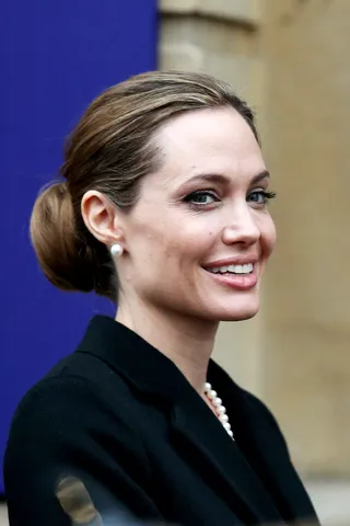 Angelina Jolie on having a preventive double mastectomy to stave off breast cancer:&nbsp; - “My chances of developing breast cancer have dropped from 87 percent to under 5 percent. I can tell my children that they don’t need to fear they will lose me to breast cancer.”  (Photo: Oli Scarff/Getty Images)