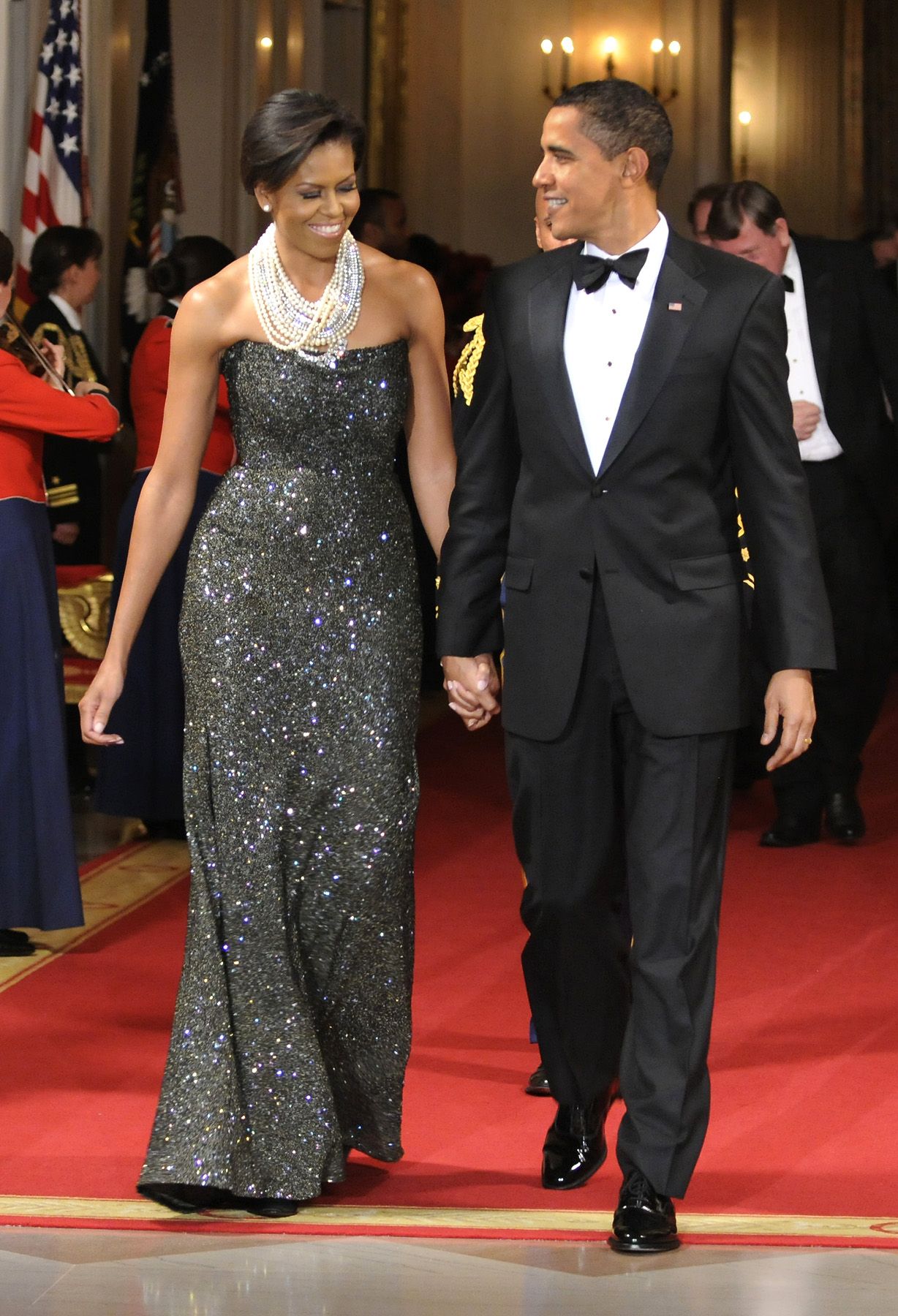 Red-Carpet Ready - In February 2009 the Obamas hosted their first formal White House dinner, and, of course, Mrs. Obama looked gorgeous in a black shimmery gown.&nbsp;(Photo: Mike Theiler-Pool/Getty Images)
