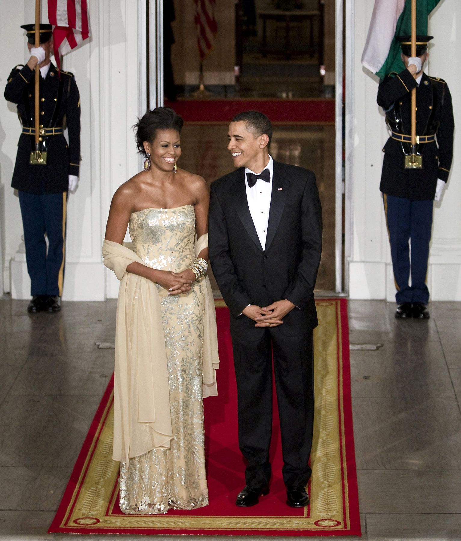 "This Is, Like, So Cool, Right?" Said the Husband to His Wife - The president and first lady await the arrival of the Indian Prime Minister Manmohan Singh and his wife Gursharan Kaurat at the North Portico of the White House Nov. 24, 2009, on the occasion of their first State Dinner.&nbsp;  (Photo: Brendan Smialowski/Getty Images)