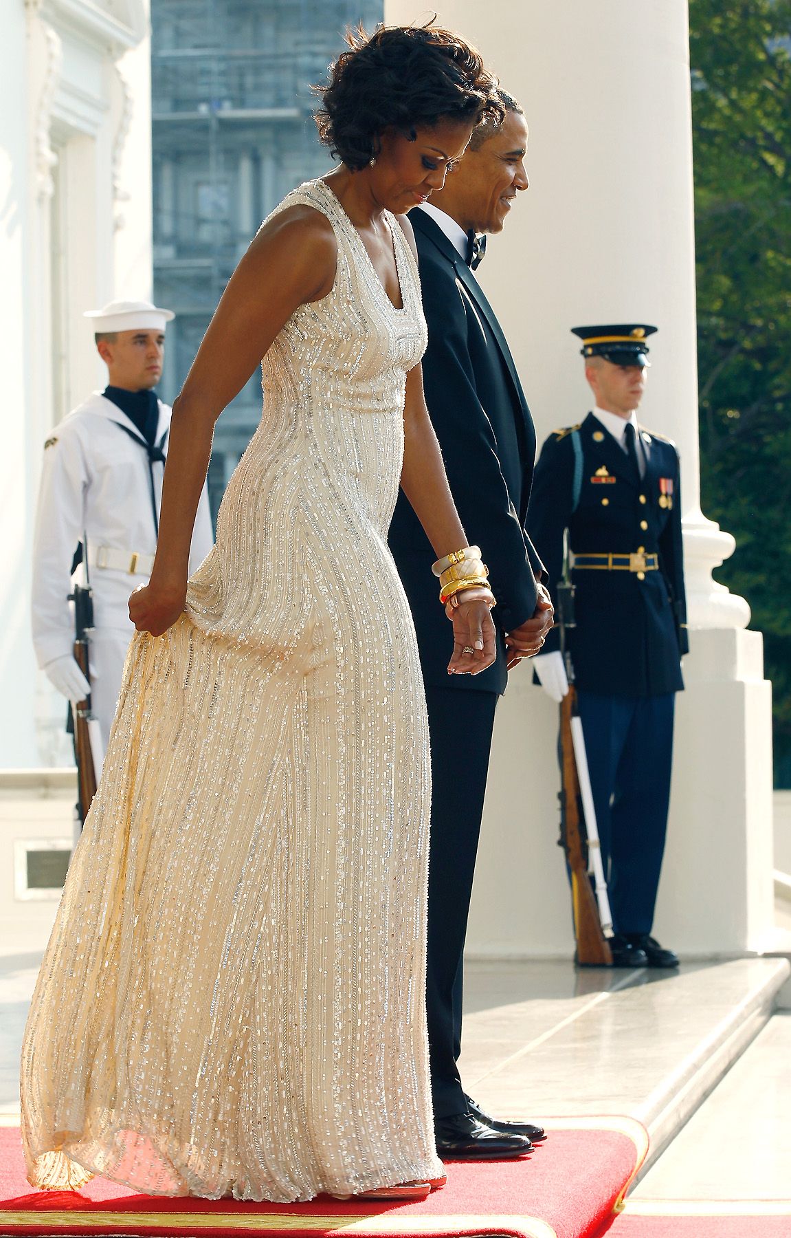 Shine Bright - Hosting the German chancellor and her husband on June 7, 2011, Mrs. Obama dazzles in a white, shimmery gown.&nbsp;(Photo: Chip Somodevilla/Getty Images)