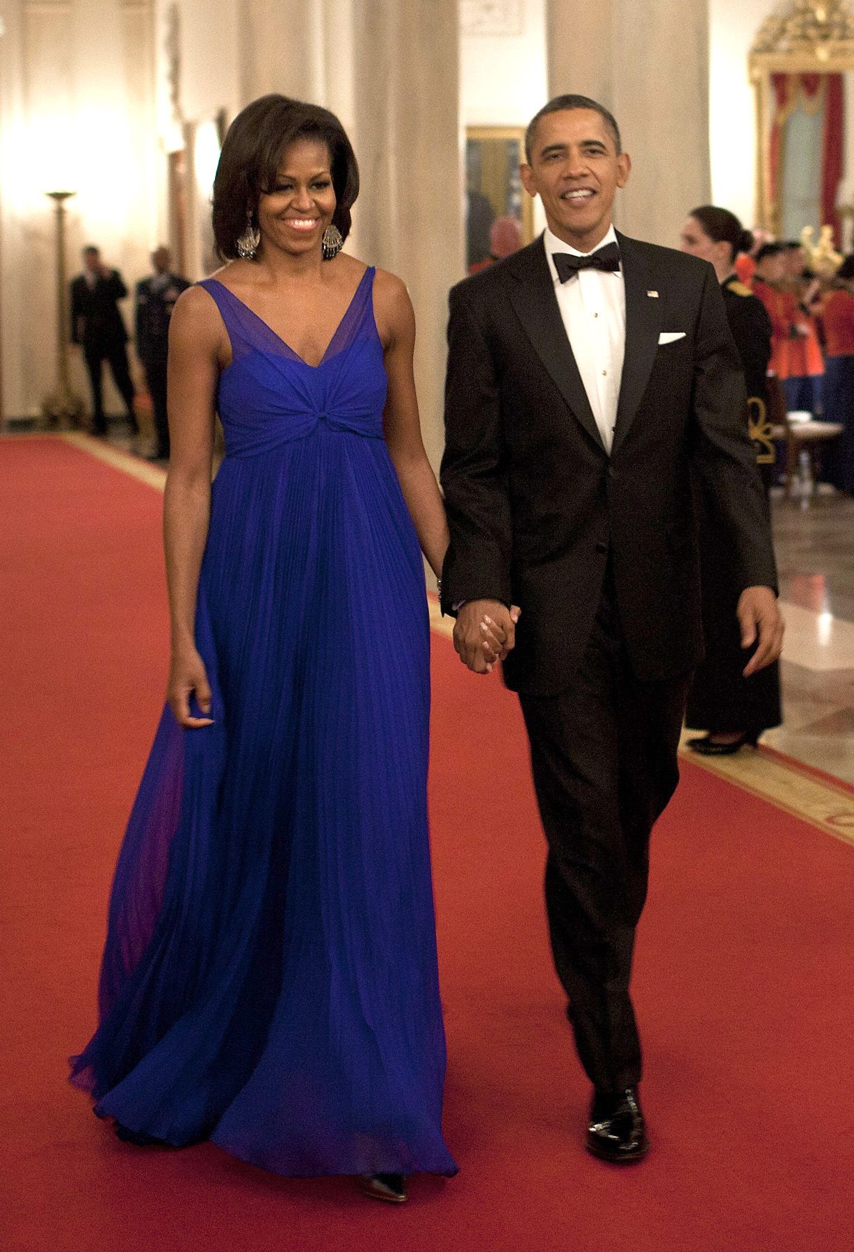 Flowing FLOTUS - The Obamas walk through the Cross Hall to the East Room of the White House on Feb. 29, 2012, in Washington. (Photo: BRENDAN SMIALOWSKI/AFP/Getty Images)