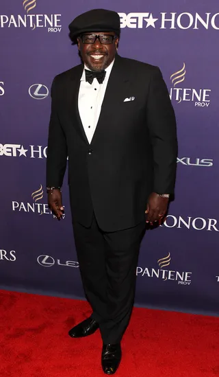 Cedric's Always the Entertainment - Comedian Cedric the Entertainer stayed true to form as he accented his tuxedo with a black newsboy cap and black rimmed spectacles.(Photo: Paul Morigi/Getty Images for BET)