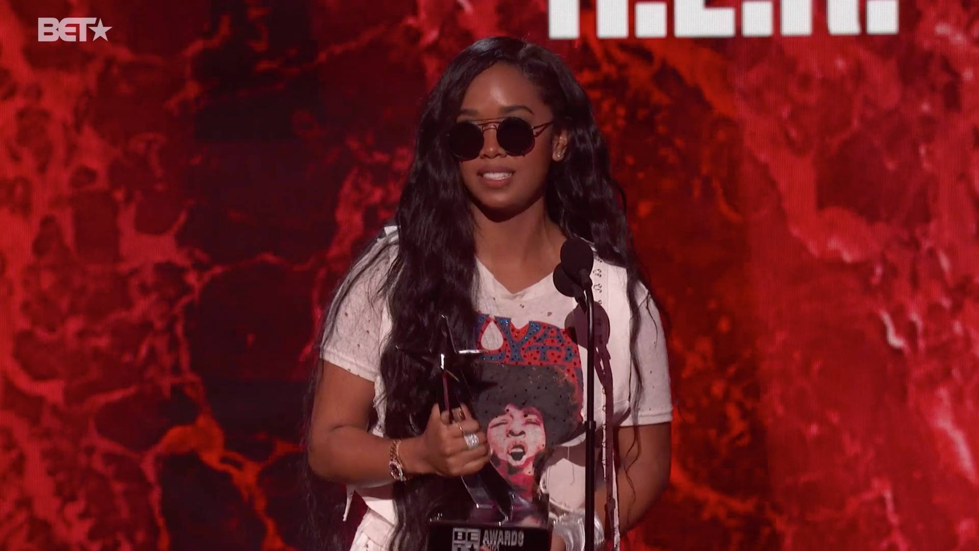 The trophy for Best Female R&B/Pop Artist goes to H.E.R. at the BET Awards 2021.