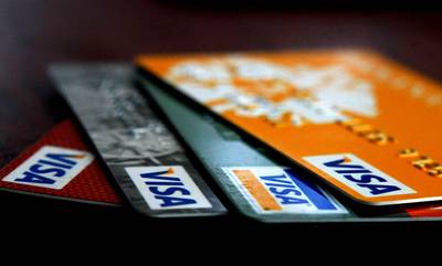 DO Avoid the Credit Card Sign-Up Tables - No matter how many free T-shirts they are offering, do not sign up for a credit card on campus. You don’t need it and your future self would much rather you didn't sabotage her credit score before graduation.   (Photo: Justin Sullivan/Getty Images)