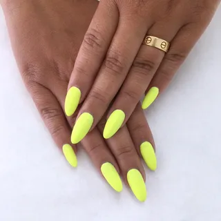 Adrienne Bailon - The Real co-host loves her some neon green. The classy almond shape really brings them out.  (Photo: Adrienne Bailon via Instagram)