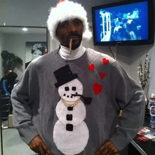 Snoop Dogg - The snowman (no not Jeezy) isn’t the only one smoking in this ugly Christmas sweater picture. Clearly Snoop had to join him.(Photo: Snoop Dogg via Instagram)