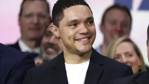 NEW YORK, NEW YORK - DECEMBER 05: Trevor Noah attends as  ViacomCBS Inc. rings the opening bell at NASDAQ on December 05, 2019 in New York City. (Photo by John Lamparski/Getty Images)