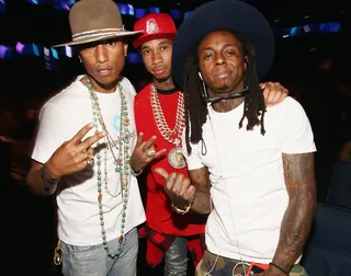 Three Different Hats - Here we have Pharrell rocking another funky hat, a trend he started at the Grammys. Next we have Tyga rocking a traditional snapback. Lastly we have Lil' Wayne in a wide-brimmed hat that gives him his rock-star edge. (Photo: Christopher Polk/BET/Getty Images for BET)