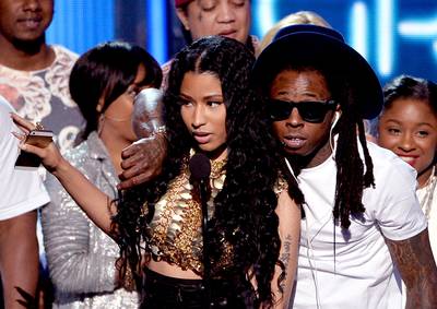 YMCMB Love Fest - Nicki Minaj had a lot to say about her YMCMB mentor, Lil Wayne, while accepting the Best Group award.&nbsp;?This is a real family, this wasn?t put together by no record label. This was hand-picked by this man right here,&quot; she said, pointing to Weezy. &quot;I thank you every day for what you put together.?&nbsp; &nbsp;&nbsp; (Photo: Kevin Winter/Getty Images for BET)