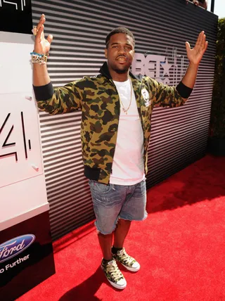 A$AP Ferg - The rapper keeps coordinated in a camo print jacket, matching Converse sneakers and denim cutoff shorts for his red carpet appearance.  (Photo: Kevin Mazur/BET/Getty Images for BET)