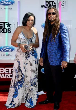 Beverly Bond and Bazaar Royale  - What a pair! The DJ and musician complement each other perfectly. She stuns in a blue floral maxi while he looks dapper in a printed cobalt blazer and slacks.  (Photo: Earl Gibson III/Getty Images for BET)