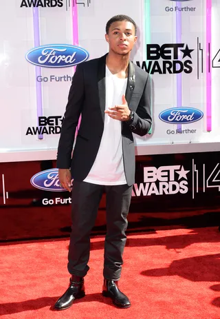 Diggy Simmons - And who says you can't pair a white tee with designer duds?&nbsp;The Start Up actor brings his own swag to his Sandro&nbsp;jacket and Gucci boots combo.  (Photo: Earl Gibson III/Getty Images for BET)