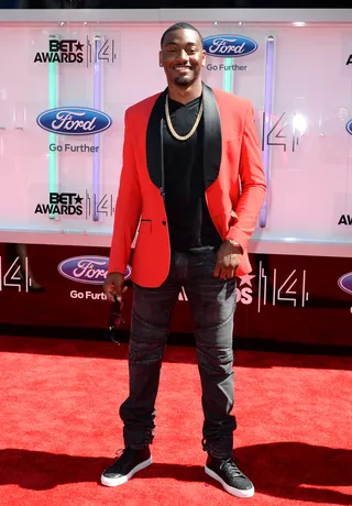 John Wall - Washington Wizards point guard John Wall shows off his fashion sense, topping his casual jeans and tee with a black-and-red tailored blazer.  (Photo: Earl Gibson III/Getty Images for BET)
