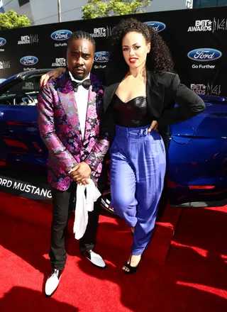 Wale and Elle Varner - Following their hit “Rover,” the rapper and singer team up for a new collaboration, this time on the red carpet. Both stars successfully work a pop of violet into their ensembles, via a floral print and high-waisted trousers.  (Photo: Johnny Nunez/BET/Getty Images for BET)