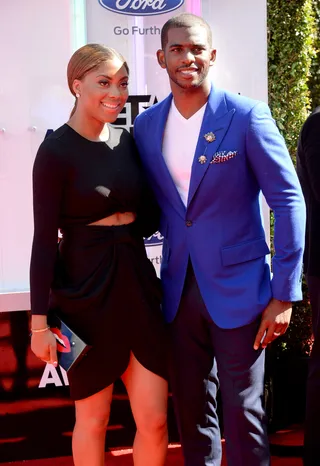 Jada Crawley and Chris Paul - The NBA baller’s wife flashes a bit of skin while Chris covers up in a cobalt blazer accented with an ornate lapel pin and navy slacks.  (Photo: Earl Gibson III/Getty Images for BET)