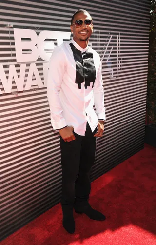 Trey Songz - Trigga makes a stylish arrival in a collarless dress shirt and dark slacks, but it’s his mesmerizing smile that gets us every time.  (Photo: Kevin Mazur/BET/Getty Images for BET)