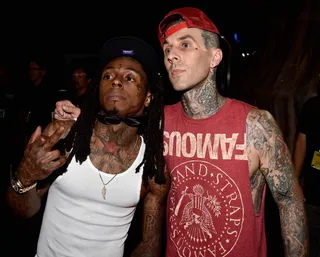 Tattoo Battle? - Rapper Lil' Wayne and drummer Travis Barker show off their rock star swag. (Photo: Frazer Harrison/BET/Getty Images for BET)