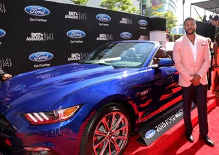Hosea Chanchez - The Game star thinks pink, breaking out a salmon dinner jacket and sleek trousers for his red carpet appearance. And that 2015 Ford Mustang doesn’t look so bad, either!  (Photo: Johnny Nunez/BET/Getty Images for BET)