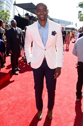 Jay Ellis - Jay Ellis brings men's fashion front and center on the red carpet sporting a tailored look with a white blazer, navy slacks and baby blue button down.(Photo: Frazer Harrison/BET/Getty Images for BET)