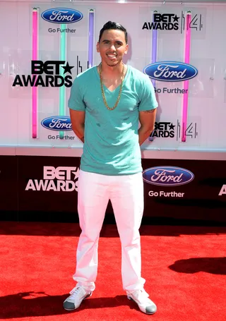 Adrian Marcel - BET's Music Matters artist stays fresh in crisp white pants, a sky blue tee and gold chain for a clean style.(Photo: Earl Gibson III/Getty Images for BET)