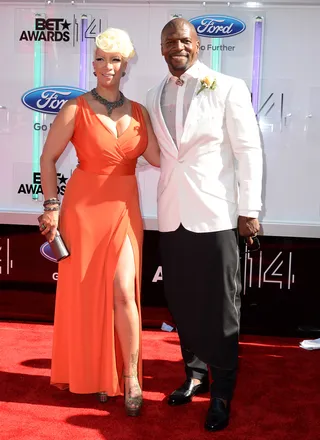Rebecca and Terry Crews - Here come the Crewses and don’t they look fabulous? Rebecca picks up on summer’s tangerine trend while her actor hubby looks sharp in classic black and white.(Photo: Earl Gibson III/Getty Images for BET)