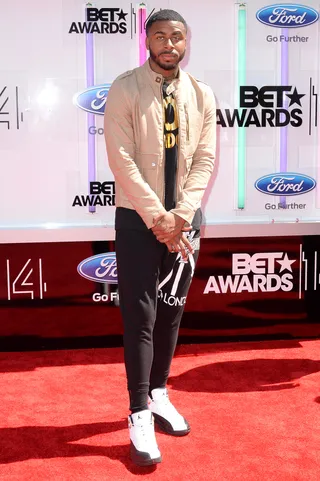 Sage the Gemini - We wouldn’t swerve on the rapper’s casual-cool mix of a linen moto jacket, graphic tee and jersey trousers, topped off with a fresh pair of Jordans, of course.  (Photo: Earl Gibson III/Getty Images for BET)