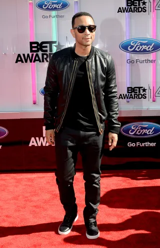 John Legend - The “All of Me” crooner is as smooth as ever in head-to-toe black, adding cool squared frames and sleek black high-tops to finish.  (Photo: Earl Gibson III/Getty Images for BET)