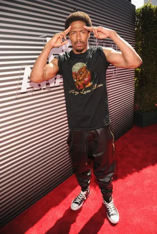 Nick Cannon - The&nbsp;Wild&nbsp;'N Out host keeps it casual on the red carpet in a cool tee, leather sweat pants and Converse shoes.(Photo: Kevin Mazur/BET/Getty Images for BET)