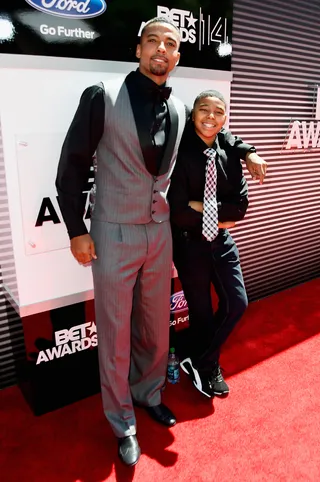Christian Keyes - Good looks run in the family! Actor Christian Keyes and his mini-me son are on the same page in coordinating suits and ties.  (Photo: Frazer Harrison/BET/Getty Images for BET)