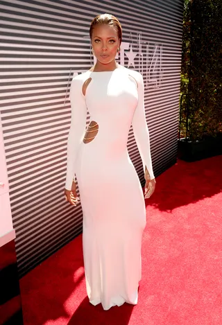 Eva Marcille - What baby weight? The top model and new mom is back in fighting form, and she’s working it in her long-sleeved white gown with sexy side cutouts.  (Photo: Kevin Mazur/BET/Getty Images for BET)