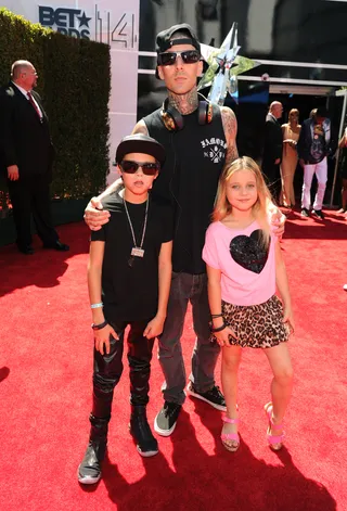 Travis Barker - The Blink-182 drummer keeps things coordinated with his cute kiddos in head-to-toe black. (Photo: Kevin Mazur/BET/Getty Images for BET)