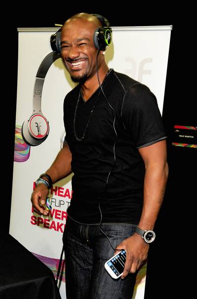 Pump Up the Volume - Radio personality Big Tigger jams to some tunes as he tests out a pair of headphones.&nbsp;(Photo: Amy Graves/BET/Getty Images for BET)