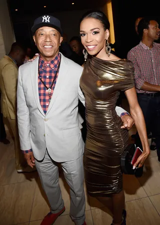 In Good Company - Business mogul Russell Simmons and songstress Michelle Williams strike a pose while enjoying the party.  (Photo: Michael Buckner/BET/Getty Images for BET)