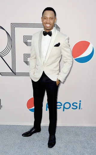 Very Smooth - Just call him Agent 007! E! News host Terrence J looks quite debonair in his cream dinner jacket and black bow tie.  (Photo: Frazer Harrison/BET/Getty Images for BET)