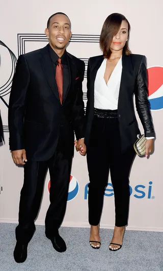 Suit Up - Ludacris and girlfriend Eudoxie keep co-ordinated in black ensembles, with Eudoxie spicing up her menswear look with a heavy side bang and tangerine lips.&nbsp;  (Photo: Frazer Harrison/BET/Getty Images for BET)