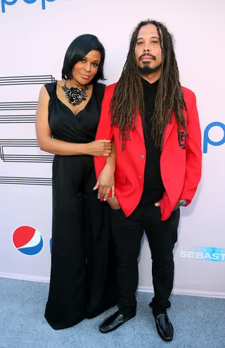 Hers and His - Black Girls Rock! founder Beverly Bond and singer Bazaar Royale are a coordinated pair in black and red.   (Photo: Mark Davis/BET/Getty Images for BET)