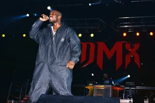1999 - DMX performs at the Hard Knock Life Tour In A Denim Jumpsuit embroidered with the Ruff Ryder logo - which became his signature look.&nbsp; (Photo: Getty Images)