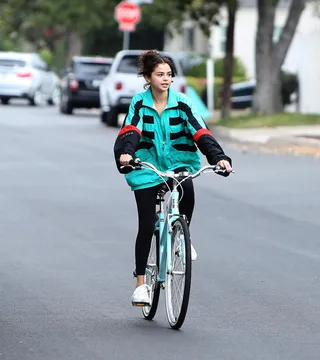 Loving Life - Selena Gomez wears The Weeknd's jacket as she goes for a bike ride with a friend in Los Angeles. &nbsp;(Photo: Miguel Aguilar/JS, PacificCoastNews)