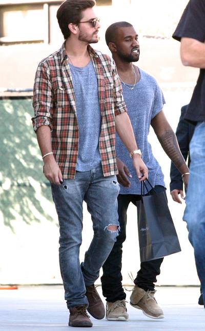 Shop 'Til You Drop - Kanye West may have finally met his shopping match in Scott Disick. The two were spotted on their way outside of Maxfield's back in November and they were rocking eerily similar shirts. Match made in paparazi heaven.&nbsp;