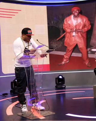 Oh No! - Recording artist Nelly gives Nick Cannon heat for wearing an oversized leather outfit back in the day!(Photo:&nbsp; Bennett Raglin/BET/Getty Images for BET)