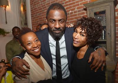 Ladies Love Idris - Idris Elba poses with leading ladies Marianne Jean-Baptiste, who played his sister in the film Takers, and Angela Bassett at the after party for the L.A. premiere of Mandela: Long Walk to Freedom, supported by Burberry at the Warwick in Los Angeles. (Photo: Charley Gallay/Getty Images for TWC)