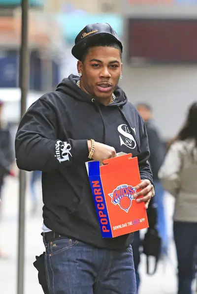 Crunch and Munch - Sports fan Nelly keeps eating his popcorn as he leaves Madison Square Garden after watching the New York Knicks lose to the San Antonio Spurs in New York City.&nbsp;(Photo: Splash News)