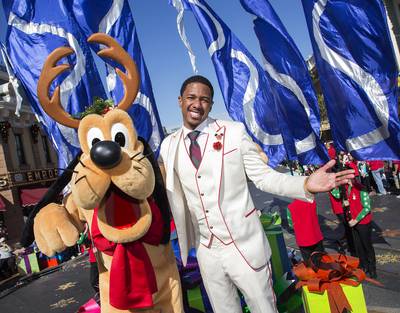 A Disney Christmas - Nick Cannon, pictured here with Pluto, hosts the Disney Parks Christmas Day Parade television special at Disneyland in Anaheim, California.&nbsp;(Photo: Paul Hiffmeyer/Disney Parks via Getty Images)