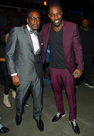 Leading Men - Hip hop pioneer and Hollywood leading man Idris Elba opted for suited look in this candid backstage moment. (Photo: Bryan Steffy/BET/Getty Images for BET)